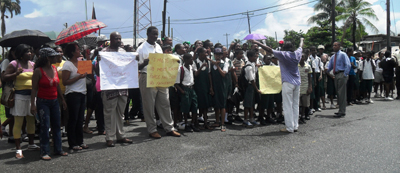 Students and supporters gather at the Wales Police Station to protest the killing of a 16-year-old student of Patentia Secondary School. 